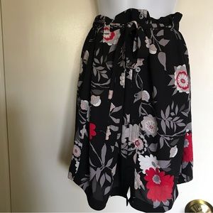 LOFT , ANN KLEIN CO .size M black with multi color flowers on it button down